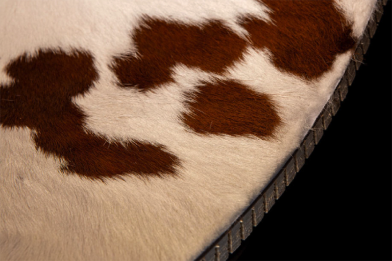 cowhide covered ottoman