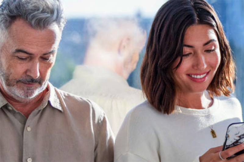 woman looking at smart phone